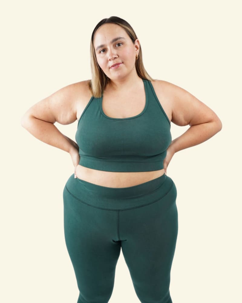 Front of a model wearing a size 6X Aspen Sports Bra in Ivy by Reprise Activewear. | dia_product_style_image_id:254071
